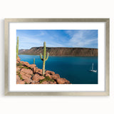 Textured art of abstract Baja California scenery in muted earth tones on a framed silver mat, suitable for bedroom art.