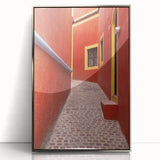 Mid-century modernist art depicting the colorful streets of Guanajuato, Mexico in a silver-framed acrylic print.