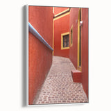 Vintage poster art of Guanajuato, Mexico, featuring colorful buildings on a black background.