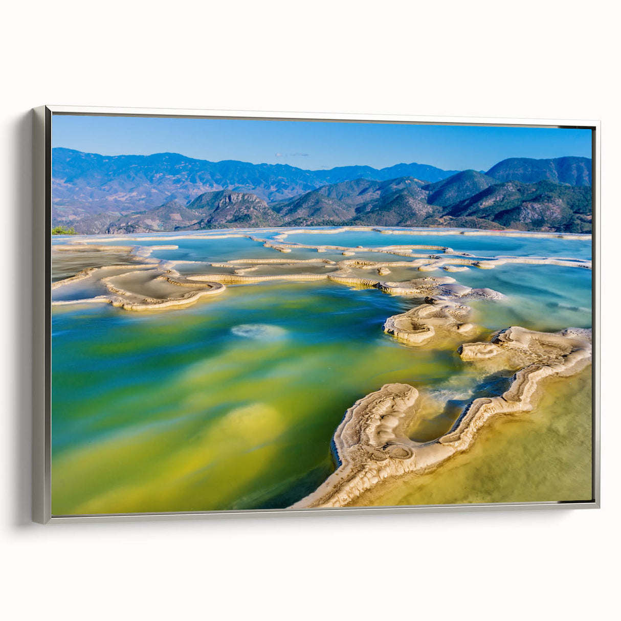 Framed canvas of a vintage Oaxaca landscape painting, featuring vibrant colors on a black background.