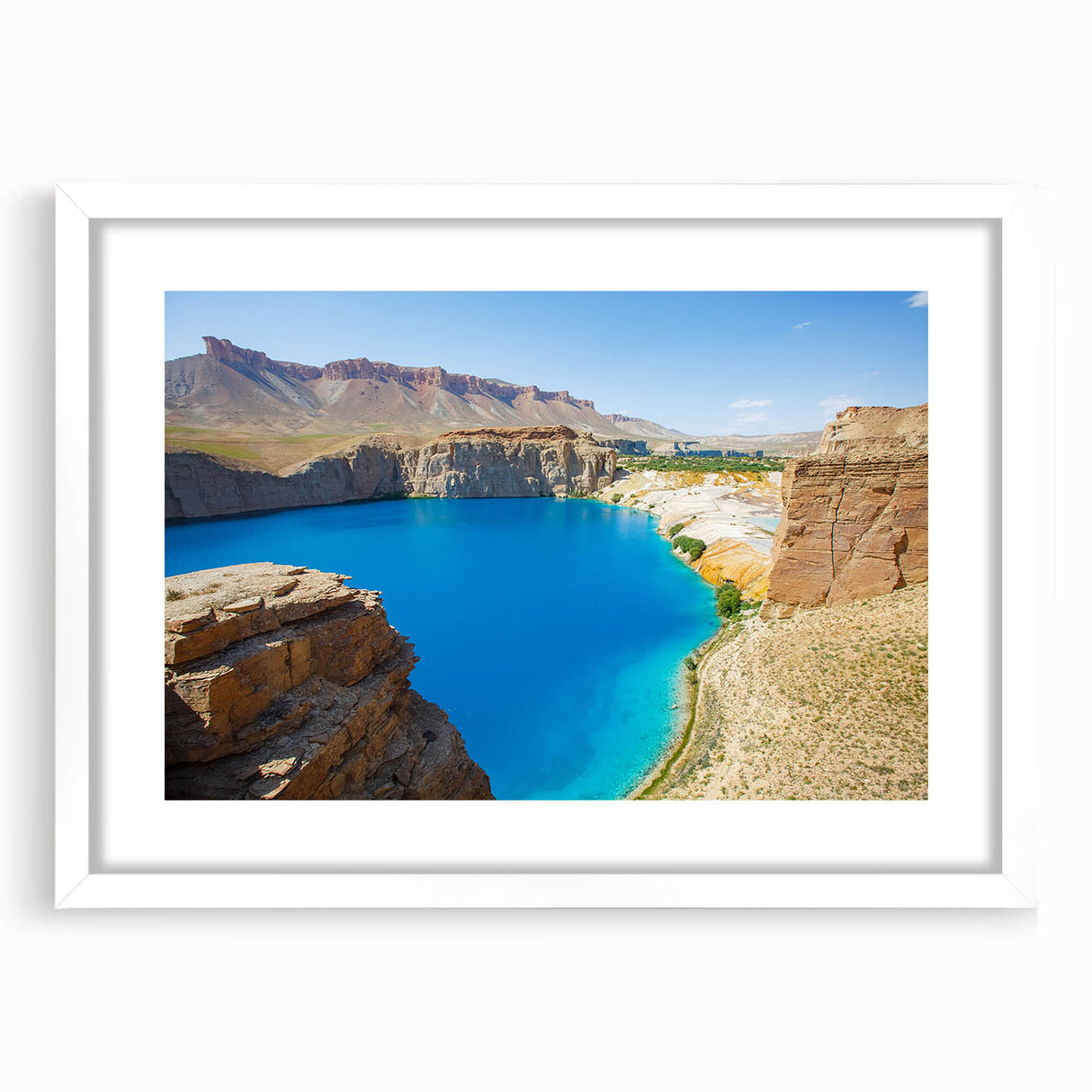 Abstract art print depicting a Middle Eastern landscape in muted earth tones on a framed white mat.