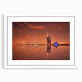 Abstract art print of Dubai skyline in muted gray and blue tones on a framed white mat, ideal for dining room decor.