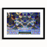 Colorful abstract art print depicting a textured Middle Eastern scenery, in a large black frame, ideal for living room decor.