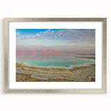 Textured art depicting the Dead Sea in muted blue and beige tones on a framed canvas, suitable for bedroom decor.