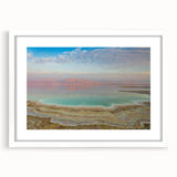 Abstract art print of the Dead Sea in muted blue and gray tones, framed in white, ideal for dining room decor.