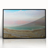 Large abstract wall art of the Dead Sea in muted blue and gray tones, framed in black acrylic.