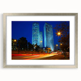 Textured abstract art print of Tel Aviv skyline in muted earth tones, framed in silver, ideal for bedroom wall decor.