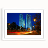 Abstract art print of Tel Aviv cityscape in muted blue and white tones, framed with a white mat, ideal for dining room decor.