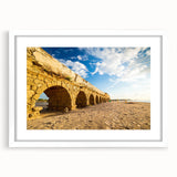 Abstract art print of a Middle Eastern landscape in muted earth tones on a white framed canvas, ideal for dining room decor.