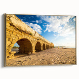 Framed canvas landscape painting of a Middle Eastern scene in muted gold and black, ideal for bedroom wall decor.