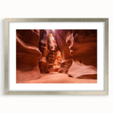 Textured abstract art print of Jordan scenery in silver frame, with muted earth tones, suitable for bedroom decor.
