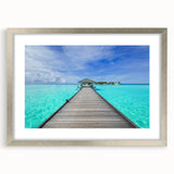 Textured art depicting abstract oceanic scenery in blue and teal tones on a silver-framed mat, suitable for bedroom art.