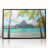 Large abstract wall art depicting a serene Tahitian landscape in muted blues and greens, framed in black acrylic.