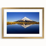 Extra large wall art featuring an abstract depiction of Mount Taranaki in muted earth tones, framed in gold.