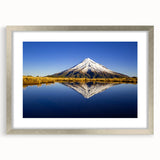 Textured art print of abstract New Zealand Taranaki scenery in silver frame, using muted earth tones, ideal for bedroom art.