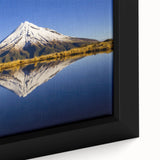 Extra large black wall art featuring a textured depiction of Mount Taranaki in New Zealand, set against a vibrant.