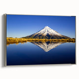Framed canvas depicting a New Zealand landscape with Taranaki mountain, featuring a blend of vibrant green and blue shades.