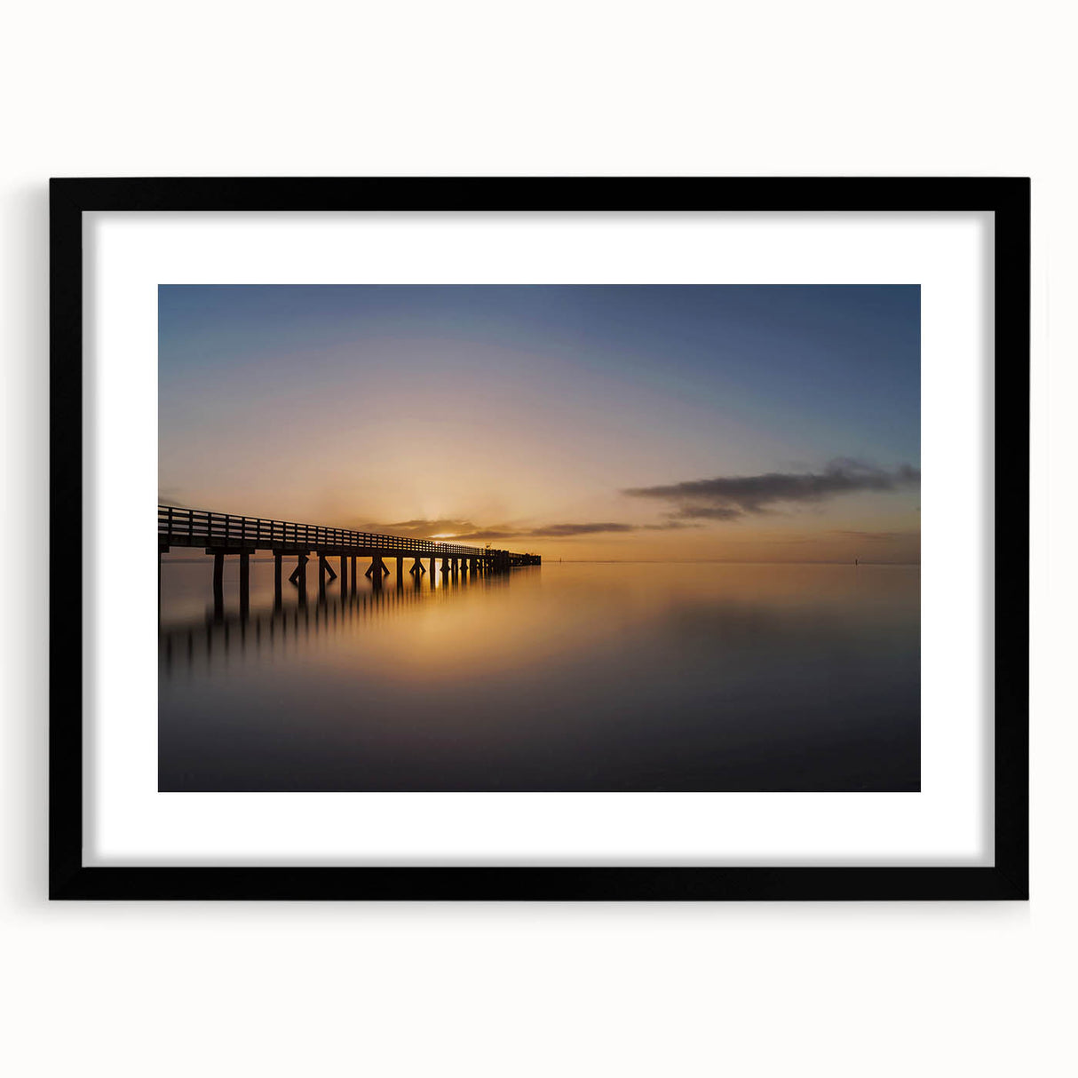 Abstract art print of New Zealand's west coast in vibrant colors on a large, textured canvas, framed in black.