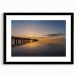 Abstract art print of New Zealand's west coast in vibrant colors on a large, textured canvas, framed in black.