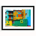Abstract art print of a colorful, textured scenery inspired by South America, displayed in a large black-framed mat.
