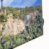 Large abstract wall art depicting a Brazilian landscape in vibrant green and blue tones on acrylic glass.