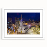 Abstract art print featuring a vibrant, colorful portrayal of a Colombian landscape on a framed white mat.