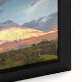 Black wall art featuring a textured close-up of a colorful Ecuadorian landscape on a framed canvas.