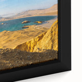 Extra large framed canvas featuring a textured depiction of a Peruvian landscape in black with colorful accents.