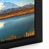 Black wall art featuring a textured Alaskan landscape on a framed canvas with colorful accents, ideal for living room decor.
