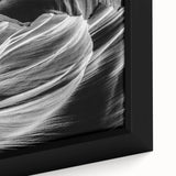 Close-up of a textured black wall art depicting Antelope Canyon in Arizona on a framed canvas, using vibrant color accents.