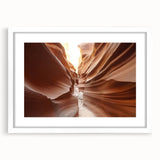 Abstract art print of Arizona's Coyote Buttes in muted earth tones, framed in white, ideal for dining room decor.