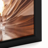 Framed canvas of Coyote Buttes in Arizona featuring textured, colorful rock formations on a black background.