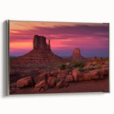 Landscape art painting of Monument Valley on a framed canvas, featuring earthy red and orange tones.