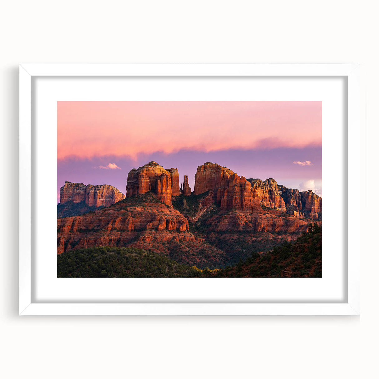 Abstract art print of Sedona landscape in muted earth tones on a framed white mat, suitable for bedroom or dining room decor.