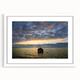 Abstract art print featuring a colorful geometric pattern on a white framed canvas, ideal for dining room decor.