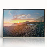 Mid-century modernist art depicting Hollywood, California scenery in muted color tones on a silver-framed acrylic print.