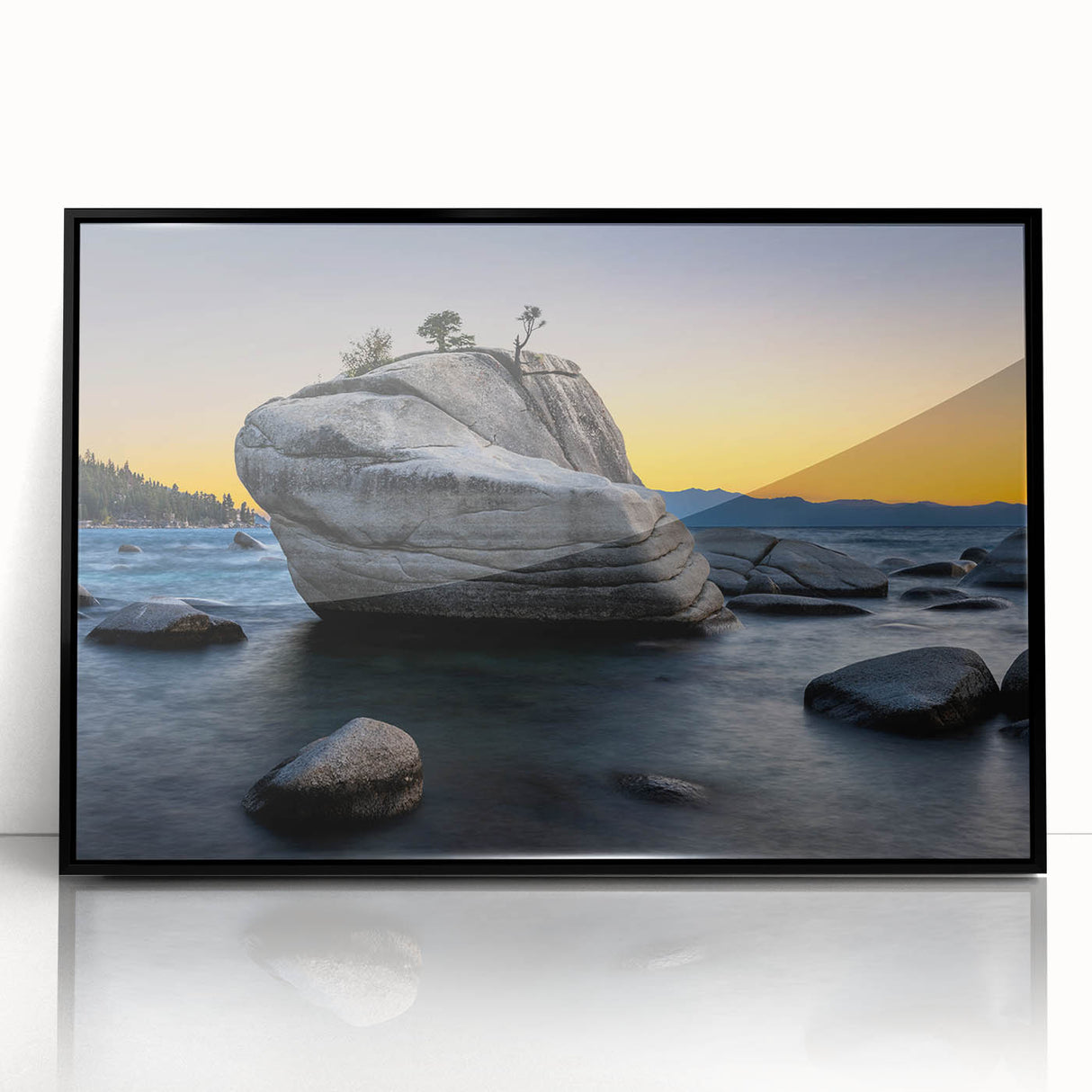 Large abstract wall art of Lake Tahoe in muted blue and green tones, framed in black acrylic.