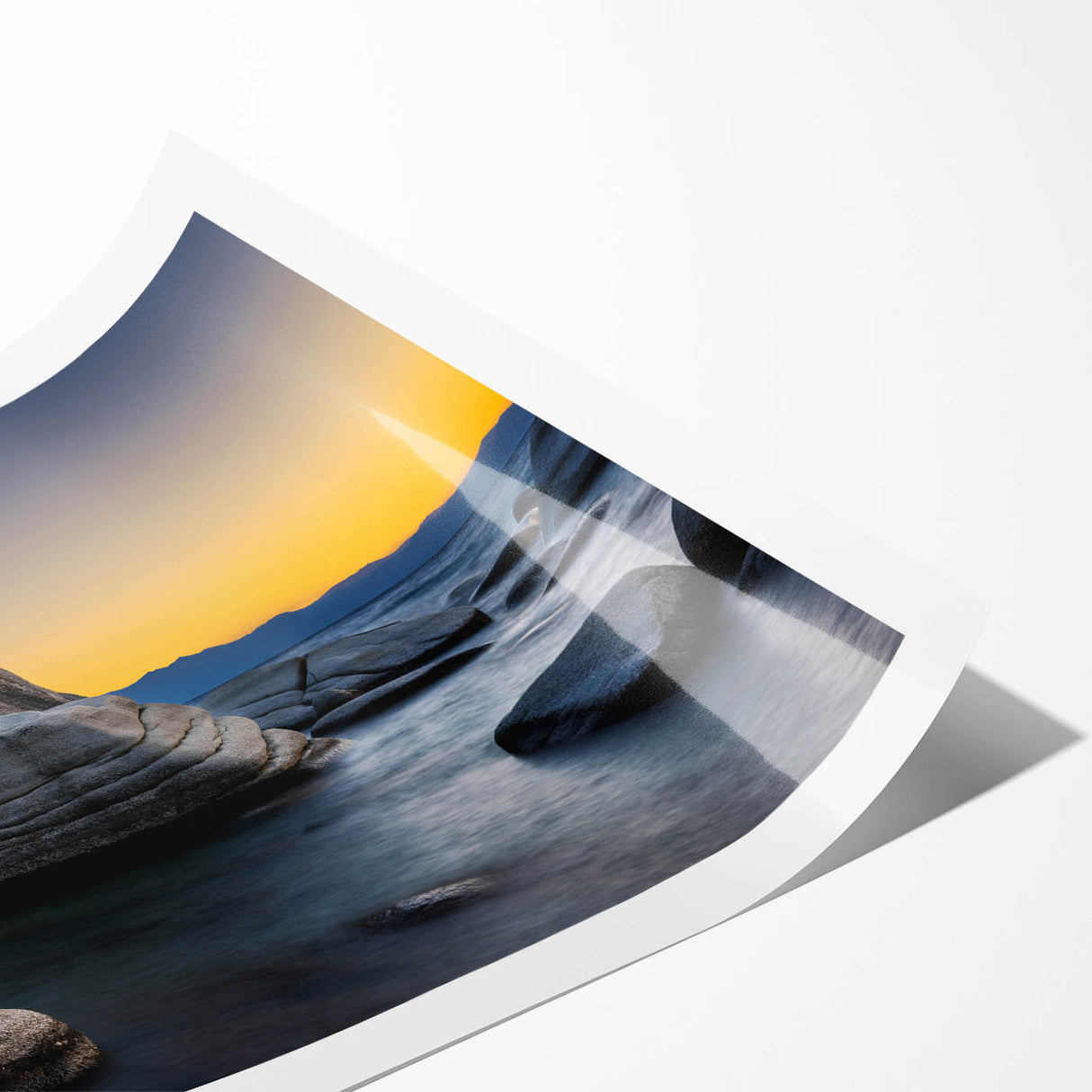 Extra large rolled print of Lake Tahoe with calm blue waters and forested shoreline, suited for large living room wall art.