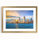 Extra large abstract art print of San Diego skyline in gold frame, featuring textured vibrant hues.