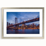 Textured abstract art print depicting the San Francisco skyline in muted gray and blue tones on a framed canvas.