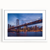 Abstract art print of San Francisco skyline in muted blue tones on framed white matte, ideal for dining room decor.