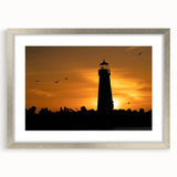Textured abstract art print depicting the Santa Cruz coastline in muted blue and grey tones, framed in silver.