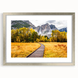 Textured art depicting Yosemite scenery in muted earth tones on a framed silver mat, suitable for bedroom decor.