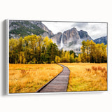 Vintage poster art of Yosemite in vibrant colors on a framed canvas, suitable for living room decor.