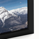 Close-up of a textured black wall art depicting Vail, Colorado scenery in vibrant colors on a framed canvas.