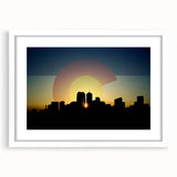 Abstract art print of Denver skyline in muted blue and gray tones on a framed white mat, ideal for dining room decor.
