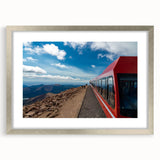Textured art print of Pikes Peak in abstract style, with muted earth tones, framed in silver, ideal for bedroom decor.