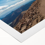 Art deco poster of Pikes Peak in Colorado, featuring muted earth tones on rolled canvas, suitable for dining room decor.