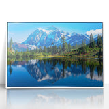 Acrylic print of Rocky Mountains with shades of gray and blue, framed in white, suitable for modern art wall decor.