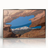 Mid-century modernist art of Colorado Springs in muted earth tones on a silver-framed acrylic print.